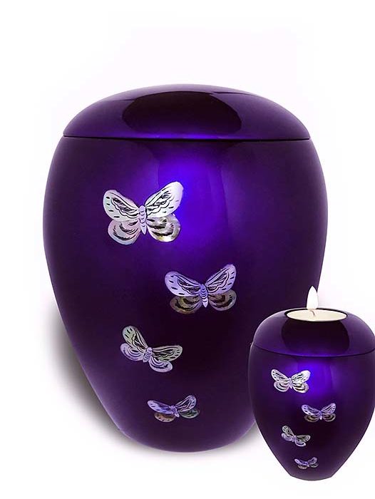 urn with wax light butterflies